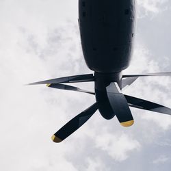 Low angle view of airplane flying in sky