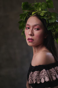 Portrait of a beautiful young woman looking away