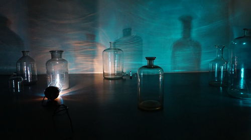 Illuminated bottles on table