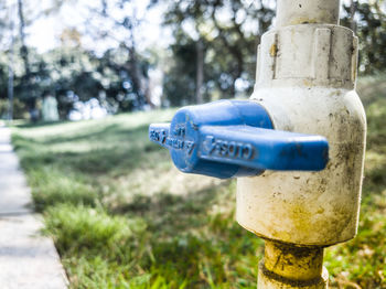 Close-up of fire hydrant against blue sky