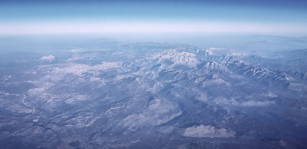 Aerial view of dramatic landscape against sky