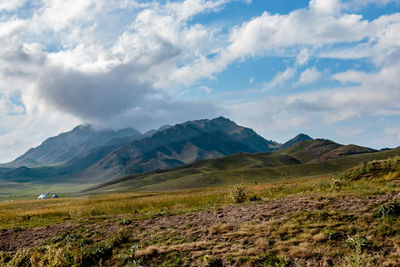 Scenic view of landscape against mountain range