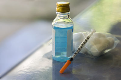 Close-up of glass bottle on table