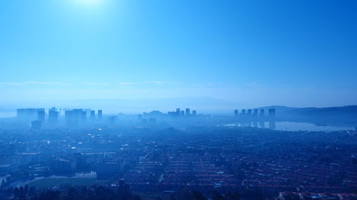 High angle view of buildings in city against sky