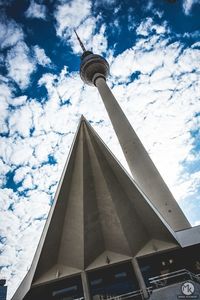 Low angle view of building against cloudy sky