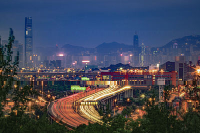 High angle view of illuminated city buildings at night