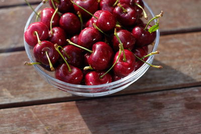 High angle view of cherries in bowl on table