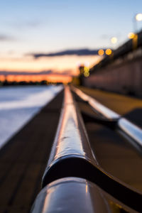 Close-up of illuminated bridge against sky during sunset