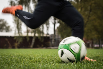 Man playing with ball on grass