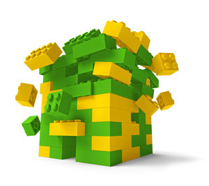 Close-up of yellow toy over white background