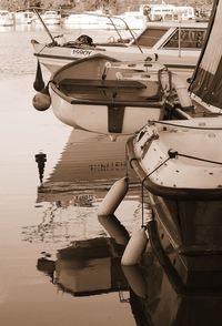 Woman on boat moored in sea