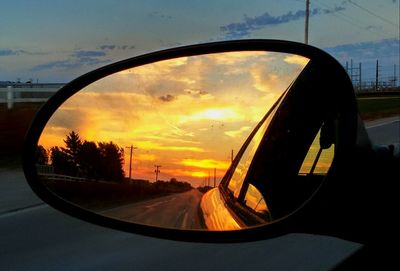 Reflection of sky on side-view mirror