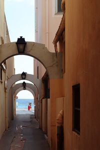 Rear view of woman walking in building