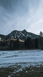 Scenic view of frozen lake against sky