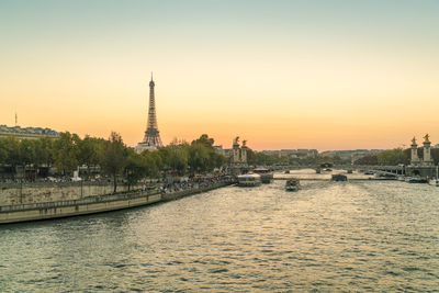 View the seine river with eiffel tower at sunset
