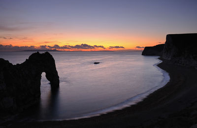 View of beach at sunset