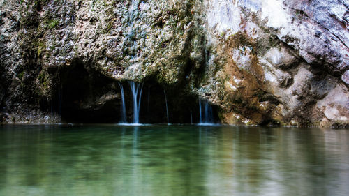 Scenic view of rock formation in sea