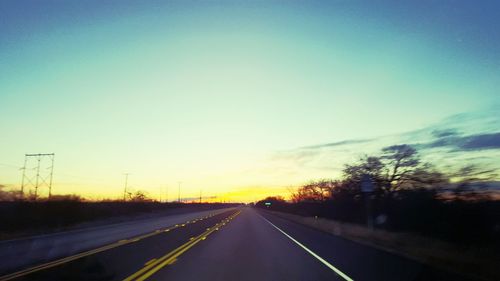 Empty road at sunset