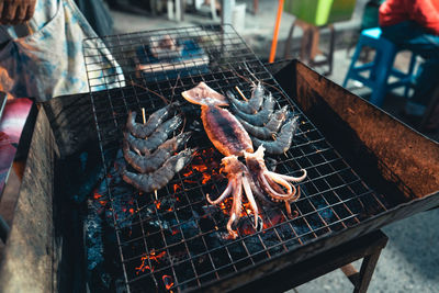 Close-up of fish on barbecue grill