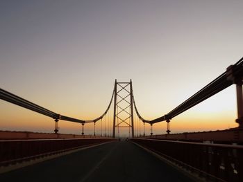 View of suspension bridge against clear sky