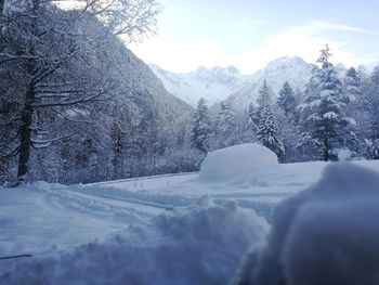 Scenic view of snow mountains against sky