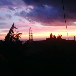 Silhouette of temple against sky during sunset