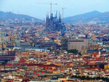 Cityscape with mountain range in background