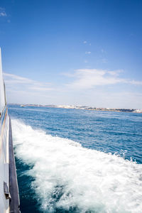 Scenic view of sea against blue sky