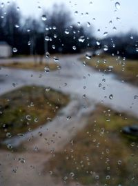 Close-up of wet windshield during rainy season