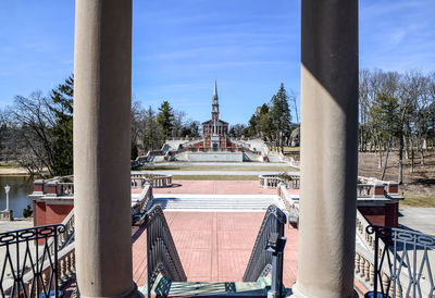 Open lawn and church building with steeple