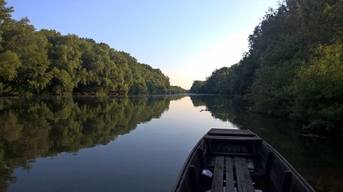 Reflection of trees in lake against sky
