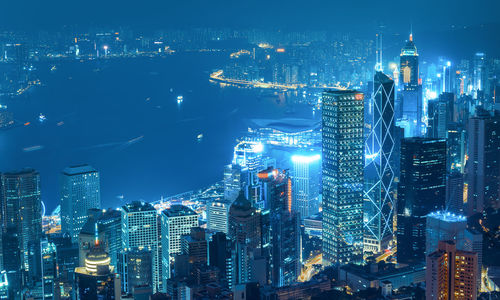Aerial view of illuminated buildings in city at night