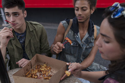 Friends enjoying fast food