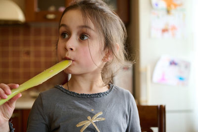 Close-up of young woman holding ice cream