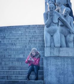 Full length of man statue against wall