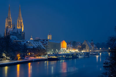 Illuminated buildings in water