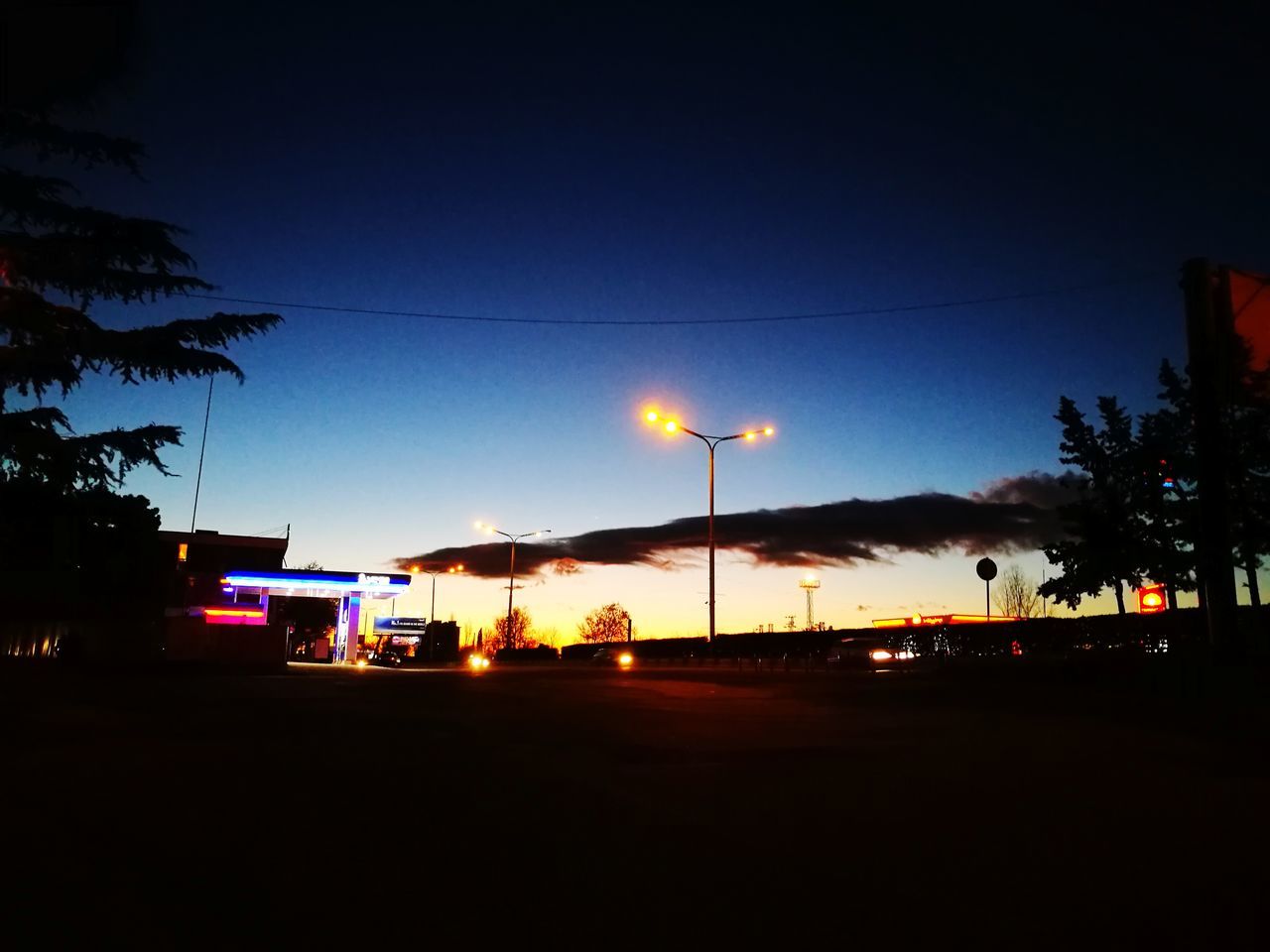 night, illuminated, car, sky, silhouette, street light, transportation, sunset, no people, outdoors, tree, nature