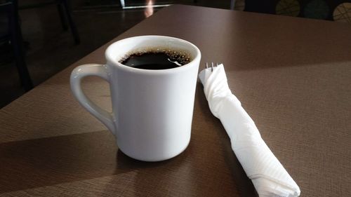 Close-up of coffee cup on table