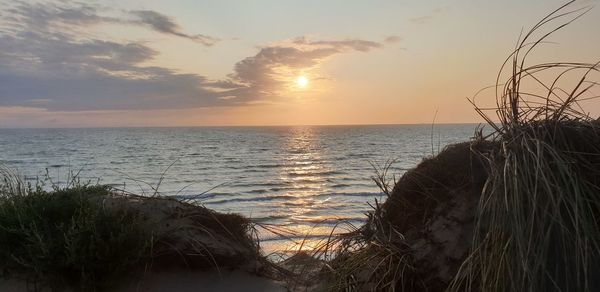 Scenic view of sea against sky during sunset