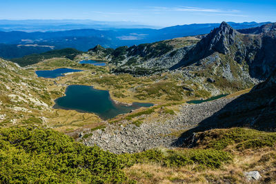 Scenic view of landscape and mountains against sky