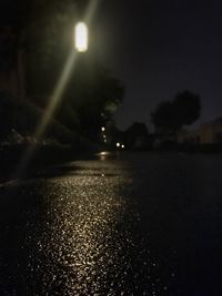 Close-up of illuminated road at night