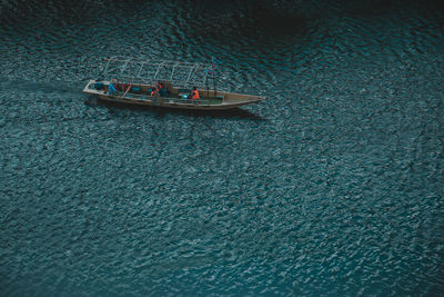 High angle view of people on boat sailing in sea