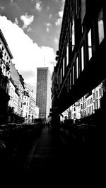 Street amidst buildings in city against sky