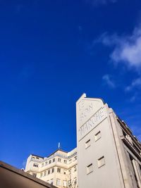 Low angle view of building against blue sky