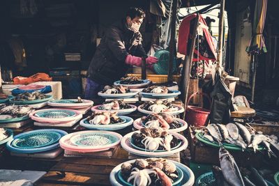 Man selling fish at market