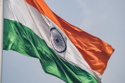 India flag flying high at connaught place with pride in blue sky, india flag fluttering, indian flag