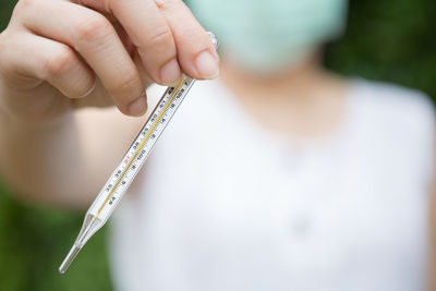 Close-up of person holding hands