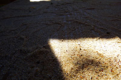 High angle view of shadow on sand