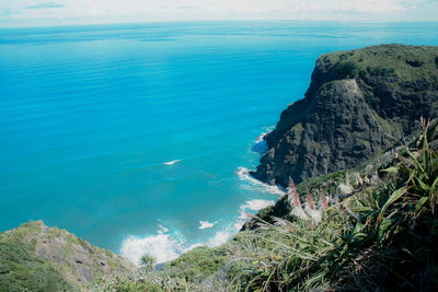 High angle view of rocks by sea