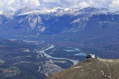 Aerial view of snowcapped mountains against sky